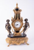 An impressive gold gilt French? Clock decorated with two cherubs either side, height 58cm.
