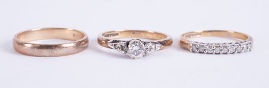 A lot of three rings to include a 9ct yellow gold wedding band, 1.63gm, size J 1/2, a 9ct yellow
