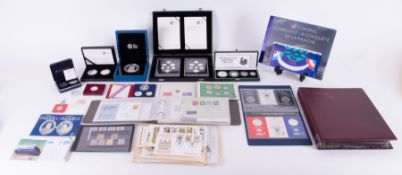 A mixed collection of various coins including Brittania silver proof set 1997, Royal Mint sets of