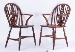 A pair of Windsor wheel back chairs.