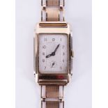 A 9ct yellow gold gent's vintage wristwatch with a rectangular shaped face and a fancy link 9ct