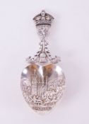 An Edwardian silver caddy spoon with the Arms of Scotland, The Royal Crown and a Thistle on the stem