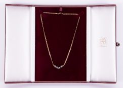 An Italian 9ct gold necklace set with sapphires in Elizabeth Duke case.