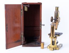 A cased microscope with extra lenses, makers mark Ross, London, 6416, with key and original fitted