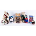 A collection of teddy bears including small Paddington bear, small Boyd bear with santa hat etc (