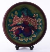 A Moorcroft finches wall charger in a mahogany frame, 38cm diameter.