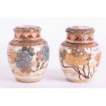 Japanese, a pair of earthenware jars with covers, height 14cm, (faults).