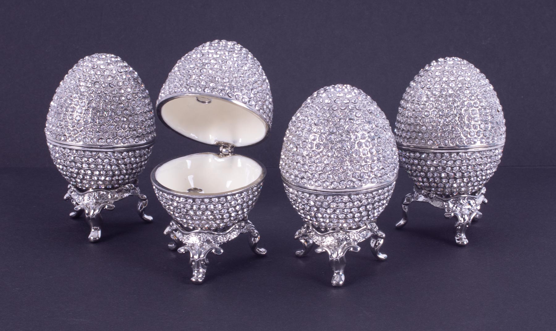 Swarovski Crystal 'style' eggs on stands (4).