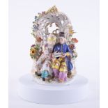 A Meissen style porcelain figure group, height 20cm.