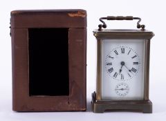 French carriage clock with alarm and platform escapement and travel case.