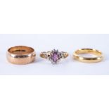 An 18ct yellow gold band, 5.41gm, size L 1/2, a 9ct yellow gold band, 4.35gm and a 9ct yellow gold