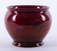 A William Moorcroft Claremont vase under a rich Ruby lustre glaze, circa 1907, height 9cm,