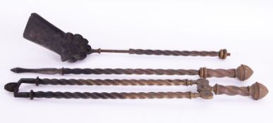 A 19th century twist brass fire companion set (3).