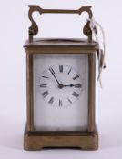 A French brass cased carriage clock with key, height including handle 18cm.