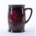 A William Moorcroft tankard decorated with Pomegranate, 12cm height, with stamp.