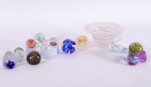 A collection of thirteen paperweights together with other glass wares.