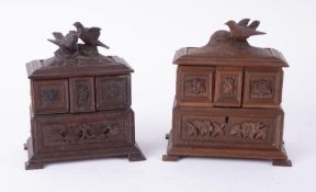 Two carved wooden jewellery boxes decorated with birds, height 20cm.
