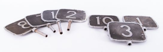 Collection of twenty four metal aisle number signs, believed to be from Plymouth, Woolworths (two