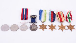 A collection of medals to include a Long Service & Good Conduct medal awarded to P.O.216790.P.CAKE.