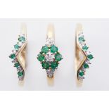 A 9ct yellow gold trinity set of rings set with round cut emeralds & round cut diamonds,