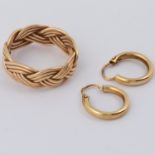 A pair of 14ct yellow gold small hoop earrings, 1.31gm and a inter woven designed ring, 5.36gm, size