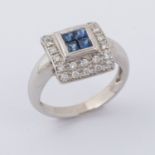 An 18ct white gold square designed ring set centrally with four square cut sapphires, total weight