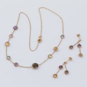 A matching set comprising of a 9ct 18" yellow gold necklace interspaced with round faceted semi-