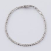 An 18ct white gold line bracelet set with round brilliant cut diamonds, total weight approx. 3.00
