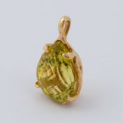 An 18ct yellow gold pendant set with a mixed cut pear shaped lime quartz, approx. 33.80 carats,