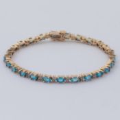 A 9ct yellow gold line bracelet set with oval cut blue topaz, approx. total weight 4.25 carats,