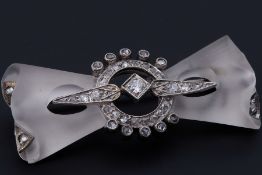An antique 14k white gold frosted glass 'bow' design brooch set with a mixture of old round cut