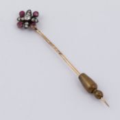 An antique tie pin set with old round cut diamonds and rubies, 2.85gm, length 6.5cm (not