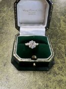 A fine Art Deco ring set with a central older round cut diamond, approx. 2.00 carats (measuring 8.