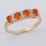 A 9ct yellow gold half eternity style ring set with four oval cut fire opals, approx. total weight