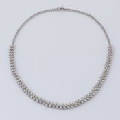 A fine fancy 18ct white gold necklace set with a mixture of pear shaped & round brilliant cut