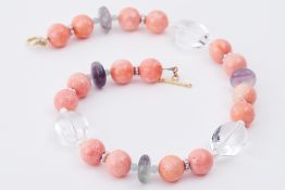A semi-precious stone bead necklace of coral, pearls, crystal, fluorite & aquamarine