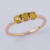 A 9ct yellow gold ring set with three round cut yellow diamonds, total diamond weight approx. 0.57