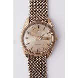 Omega, a gents 9ct yellow gold automatic Seamaster Daydate wrist watch, with champagne baton dial,