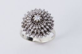 A 9ct white gold cluster style cocktail ring set with round brilliant cut diamonds, approx. 0.36