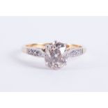 An antique 18ct yellow gold & platinum ring set with a central old oval cut diamond, approx. 1.22