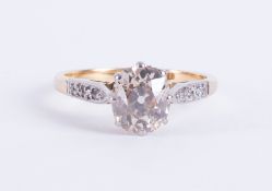 An antique 18ct yellow gold & platinum ring set with a central old oval cut diamond, approx. 1.22