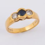 An 18ct yellow gold ring set with a central round cut sapphire, approx. 0.25 carats with a round