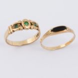 A 9ct yellow gold scroll design ring set with three round cut emeralds, 2.90gm, size Q 1/2 and a 9ct