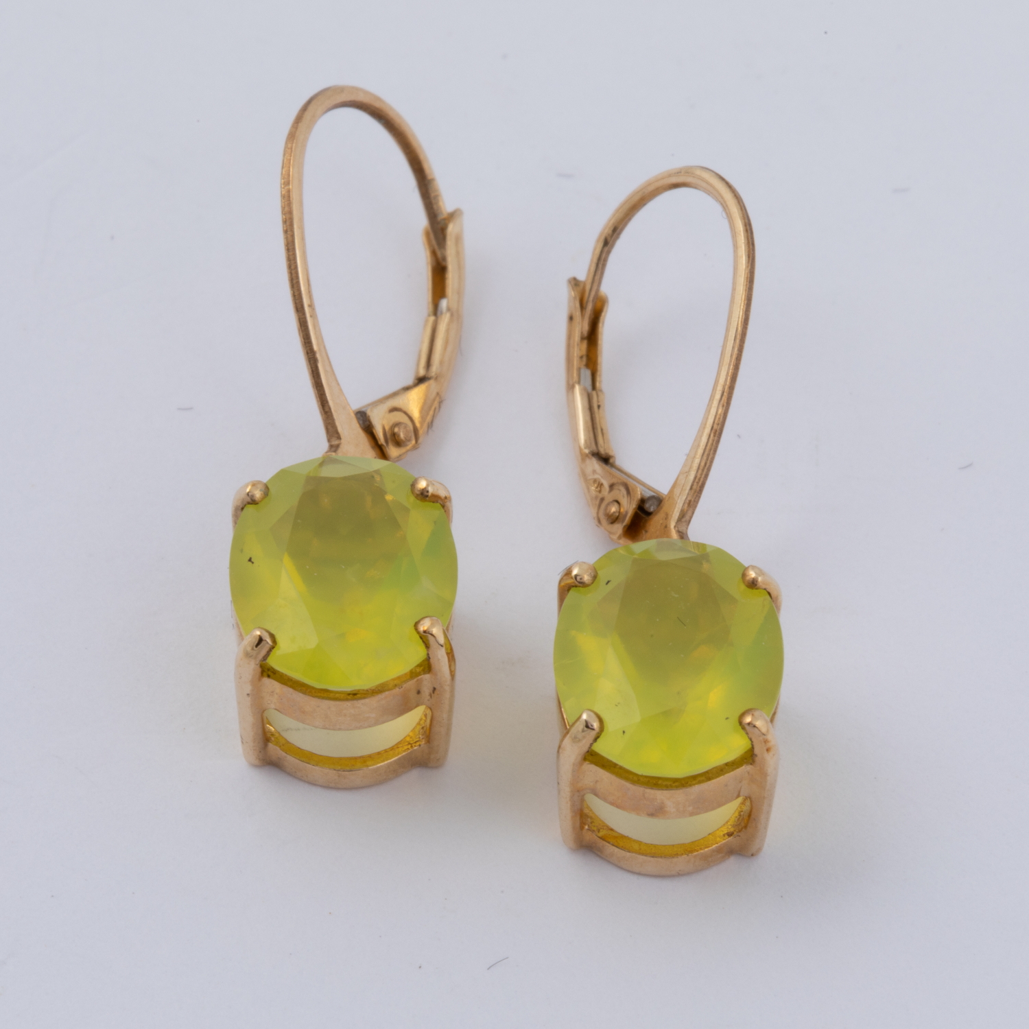 A pair of 9ct yellow gold drop earrings set with Mali green Opal, total weight approx. 3.57ct, 3.