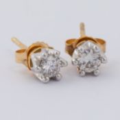 A pair of 18ct yellow & white gold stud earrings set with round brilliant cut diamonds, total