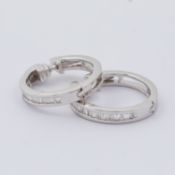 A pair of 18ct white gold hoop earrings set with baguette cut diamonds, approx. total weight 0.26