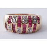 A 14k yellow gold ring set with square cut rubies and small round cut diamonds in an