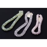 A mixed lot to include a string of rose quartz beads, a string of rock crystal beads and a string of