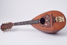 An Italian mandolin with label 'Strident, Napoli'.