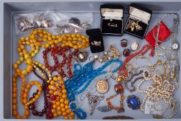An interesting large selection of costume jewellery & some silver items including beads, faux